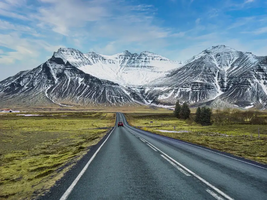 Car Riding Towards Mountains In Iceland