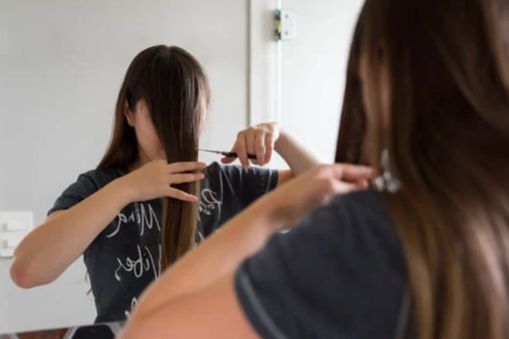 Layered face-framing cut with bangs